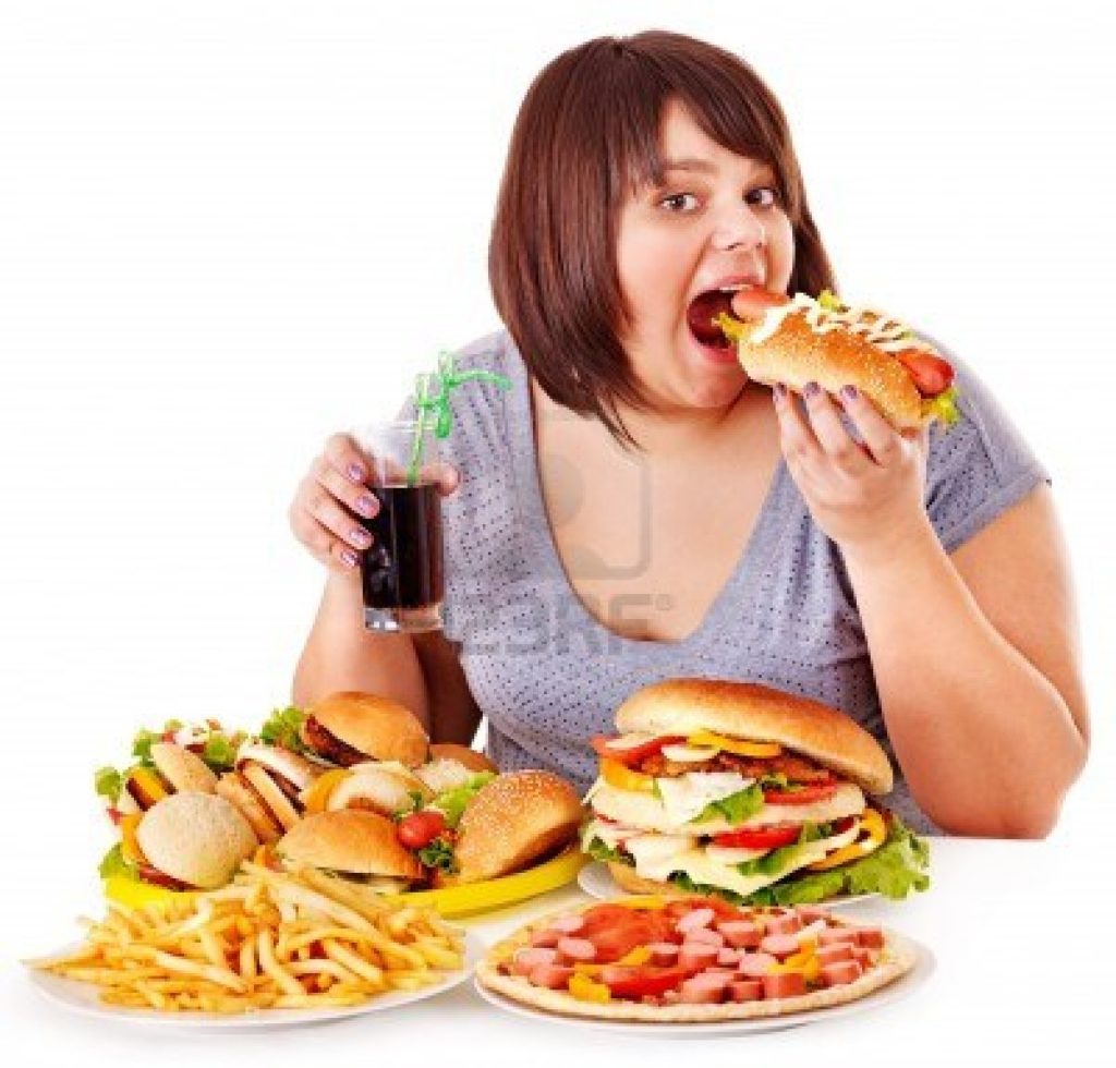15231877-overweight-woman-eating-fast-food