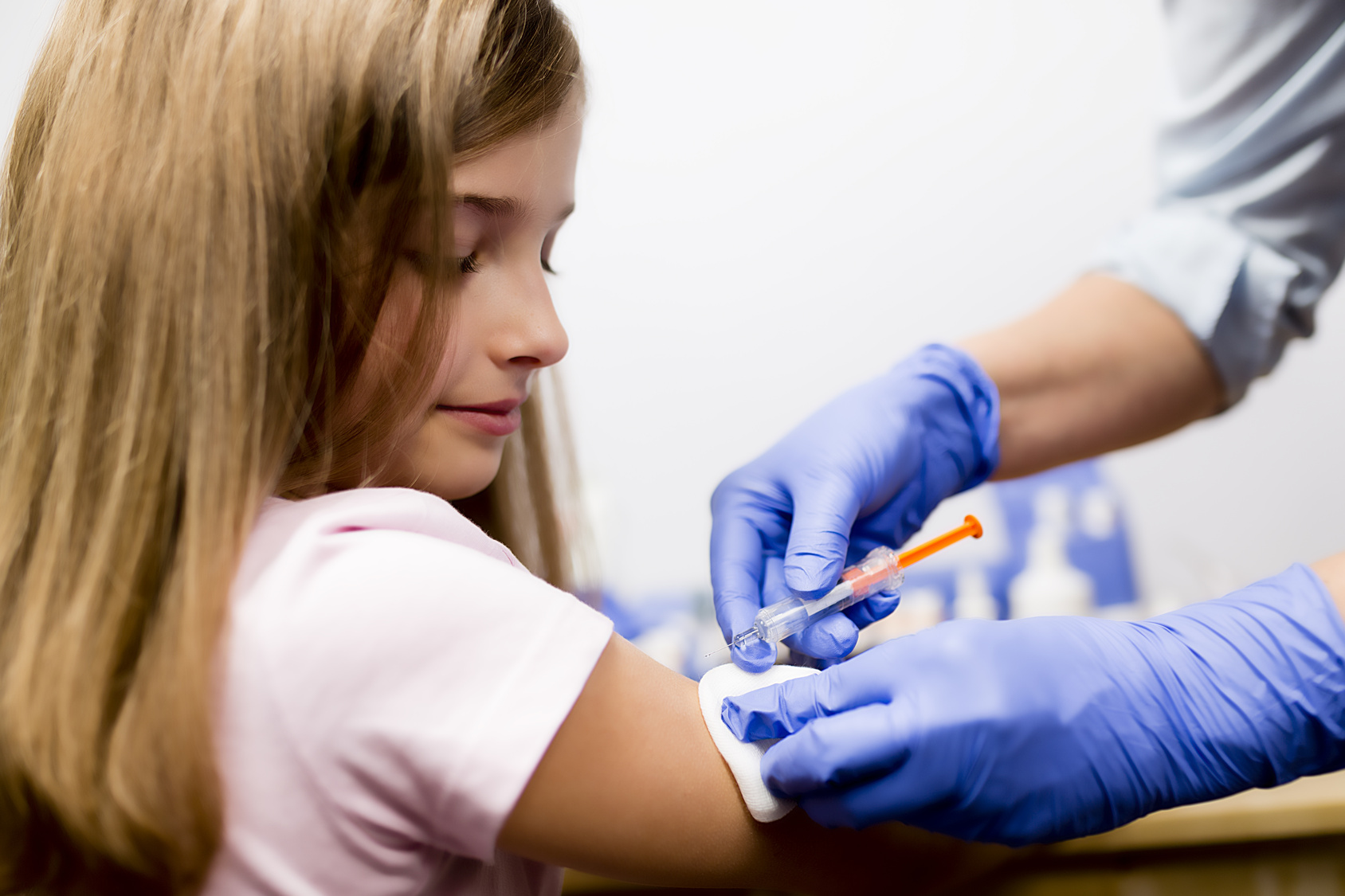 Vaccine - a doctor giving  vaccination girl, health, prevention